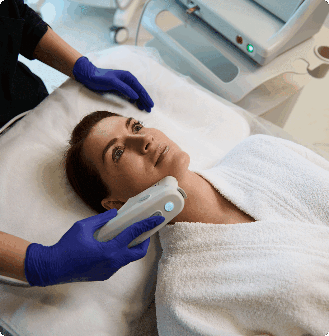 Facial treatment with device in spa setting.