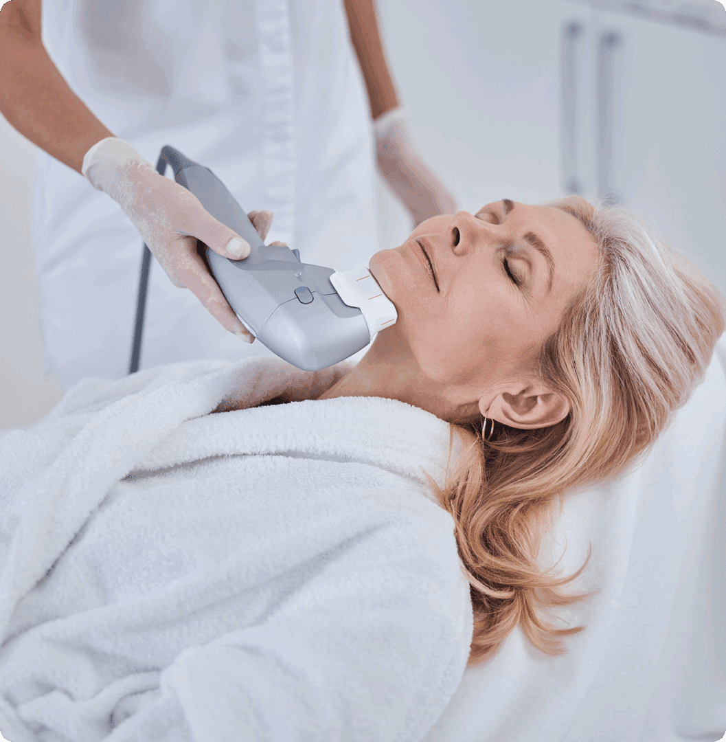 Woman receiving facial treatment in spa.